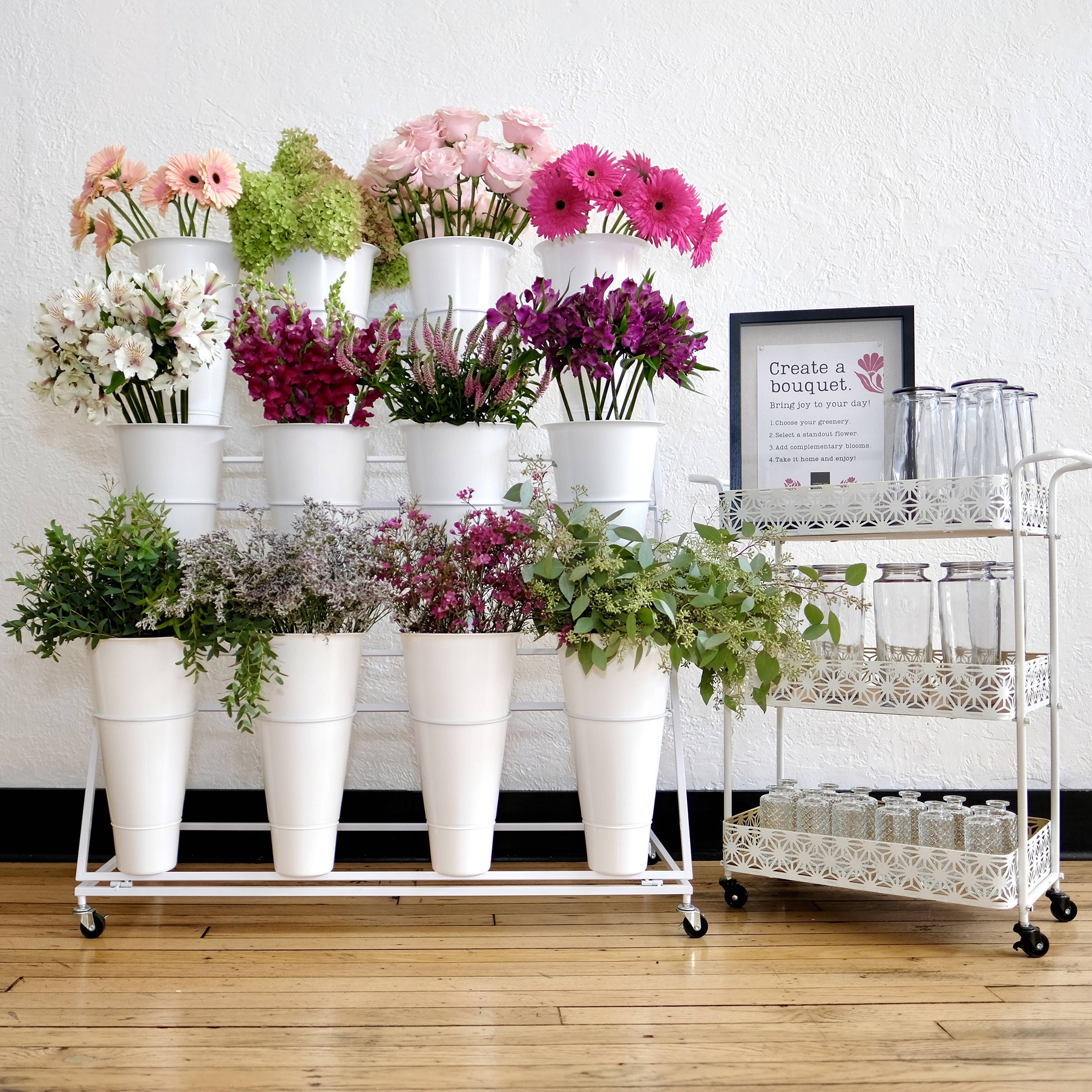 Build-your-own bouquet station — guests picking fresh stems